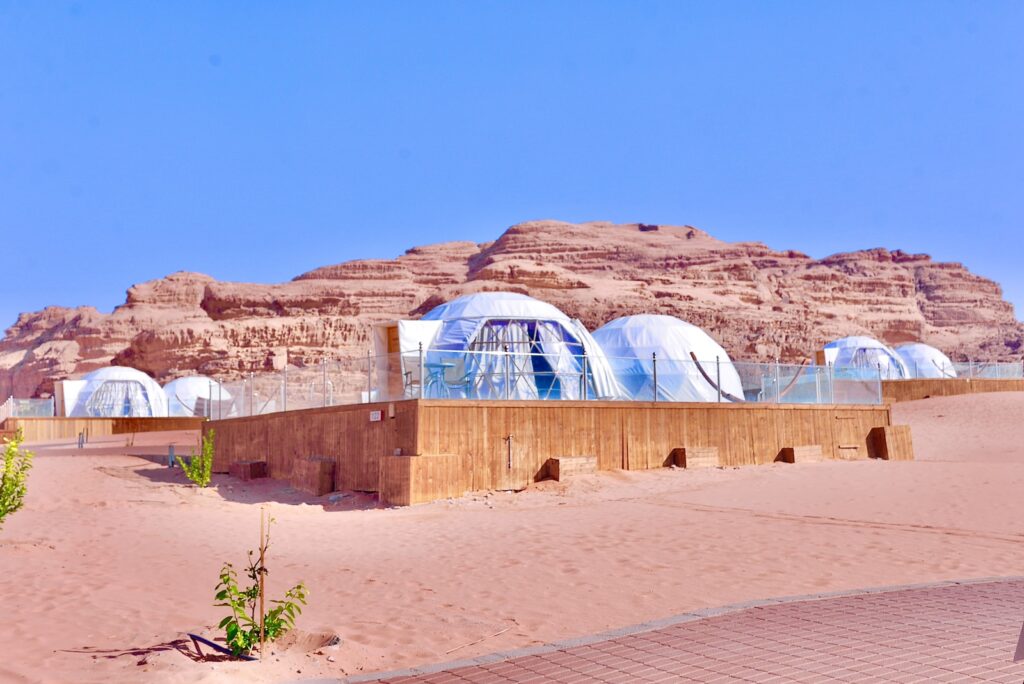 a desert area with several domes in the middle of it